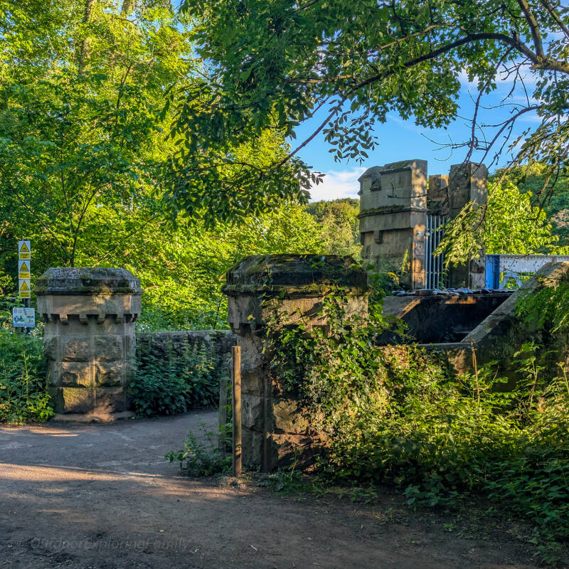 Stone turrets and entrance to Deepdale Aqueduct near Barnard Castle, showing the decorative Victorian masonry beside the footbridge.