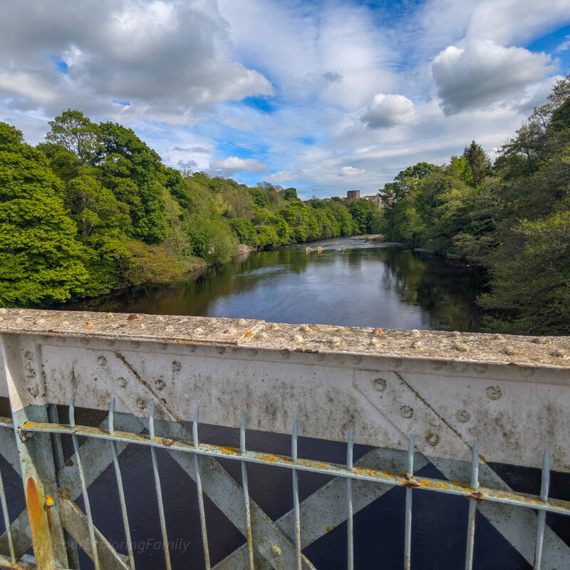 View from Deepdale Aqueduct looking along the River Tees towards Barnard Castle and the castle above the trees.