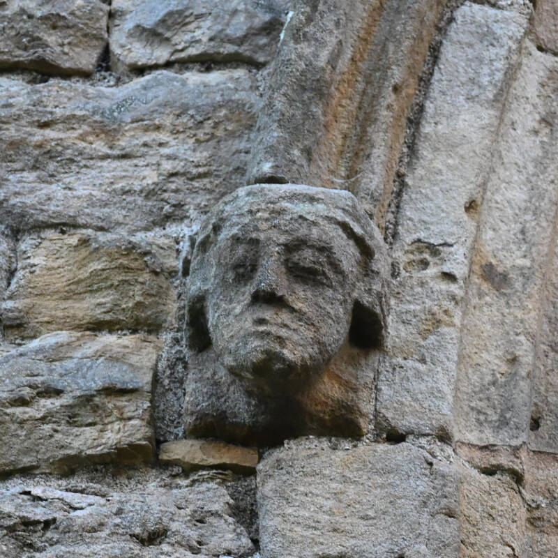 Hidden carved medieval stone face at Egglestone Abbey in Teesdale.