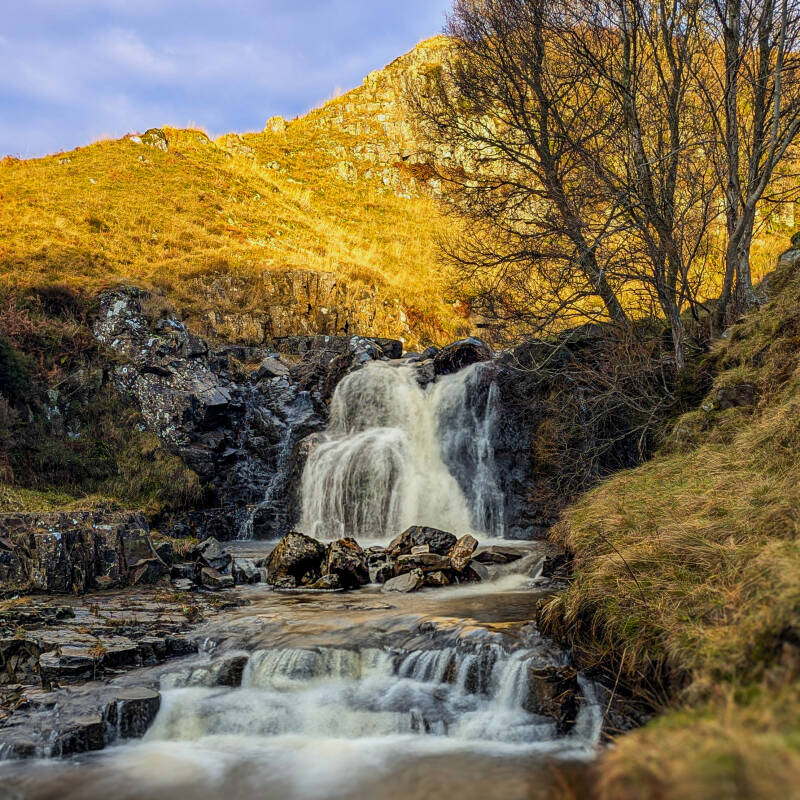 Flushiemere Beck Waterfall flowing over rocks in the Upper Teesdale countryside