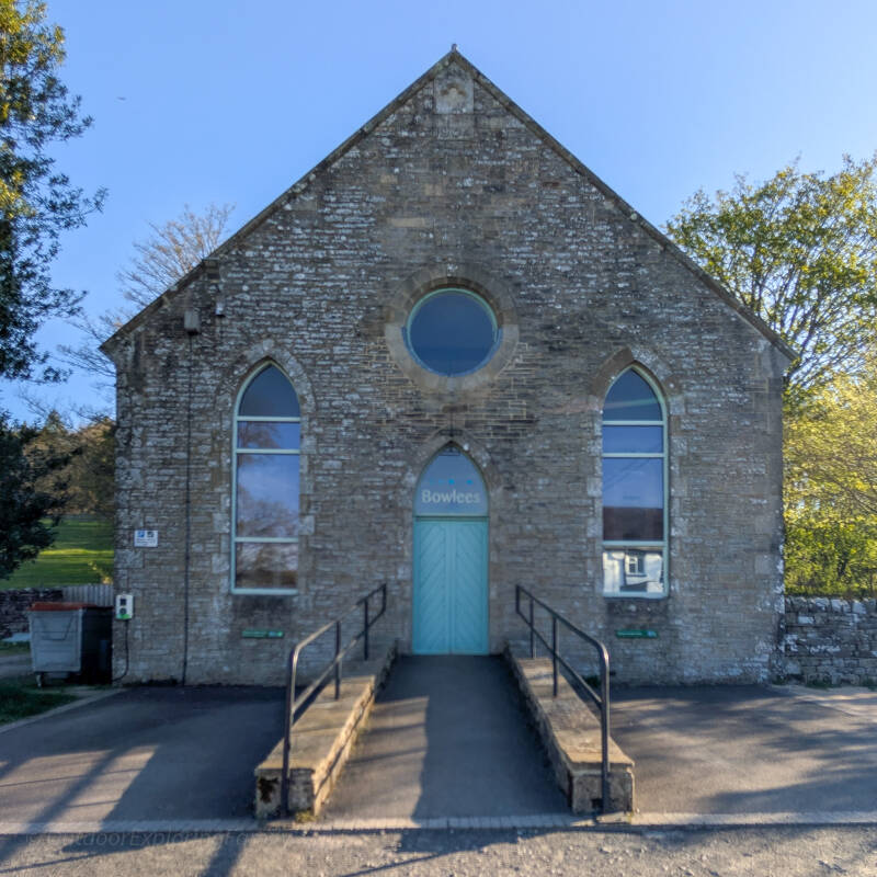 Front entrance of Bowlees Visitor Centre former chapel building in Teesdale with arched windows and stone detail
