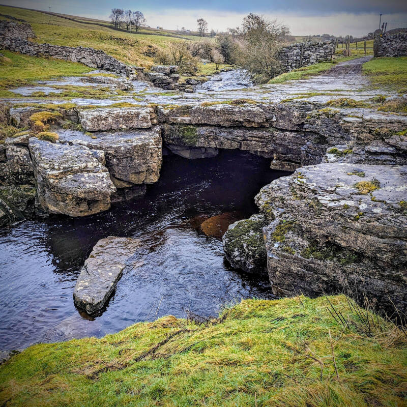 Walking route near God's Bridge in Teesdale, passing open countryside, limestone scenery and traditional dry stone walls.
