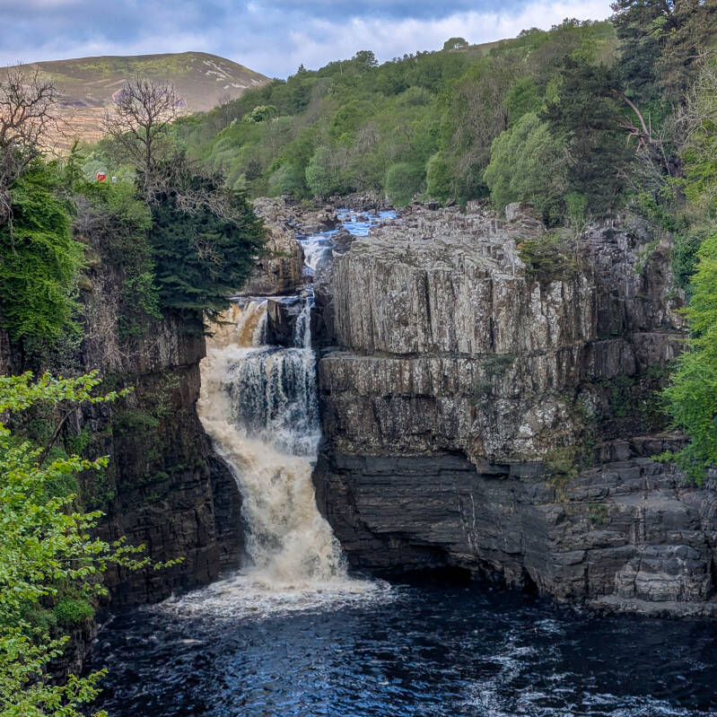 High Force waterfall on the River Tees surrounded by the rocky Upper Teesdale gorge
