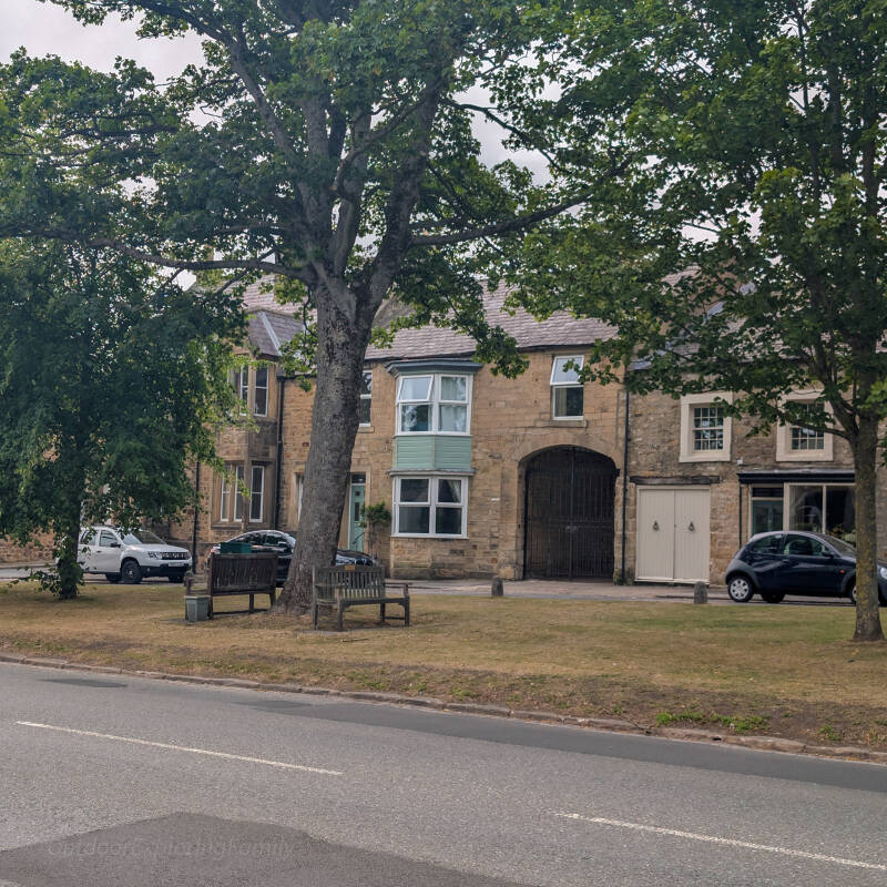 Historic stone houses and a small green on upper Galgate in Barnard Castle.