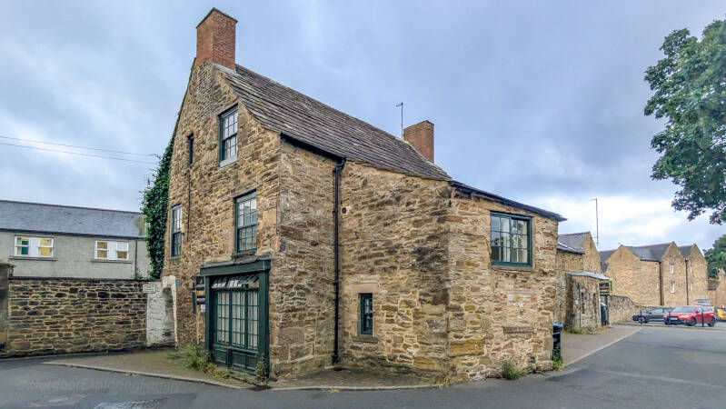 Wide view of the Hole in the Wall building beside Queen Street car park in Barnard Castle.