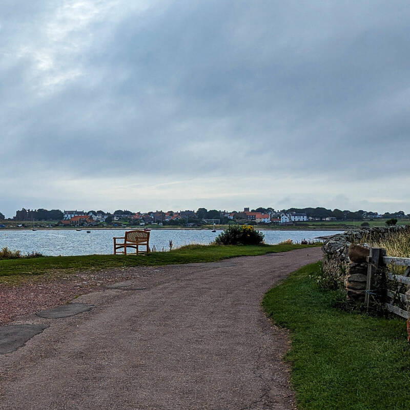 Path beside the harbour looking towards Holy Island village on the Lindisfarne circular walk
