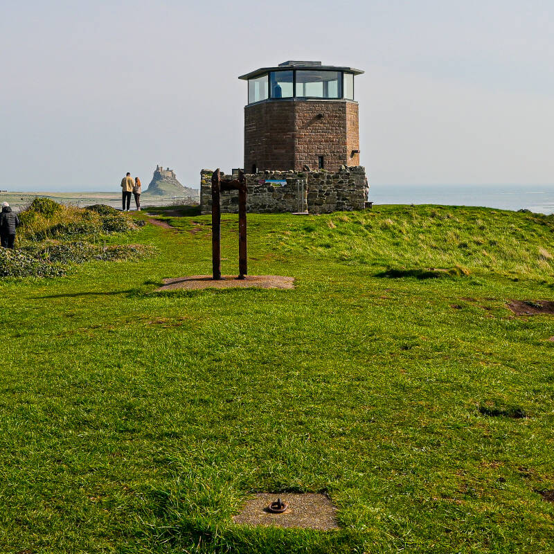 Holy Island Lookout Tower on the Heugh with Lindisfarne Castle visible in the distance