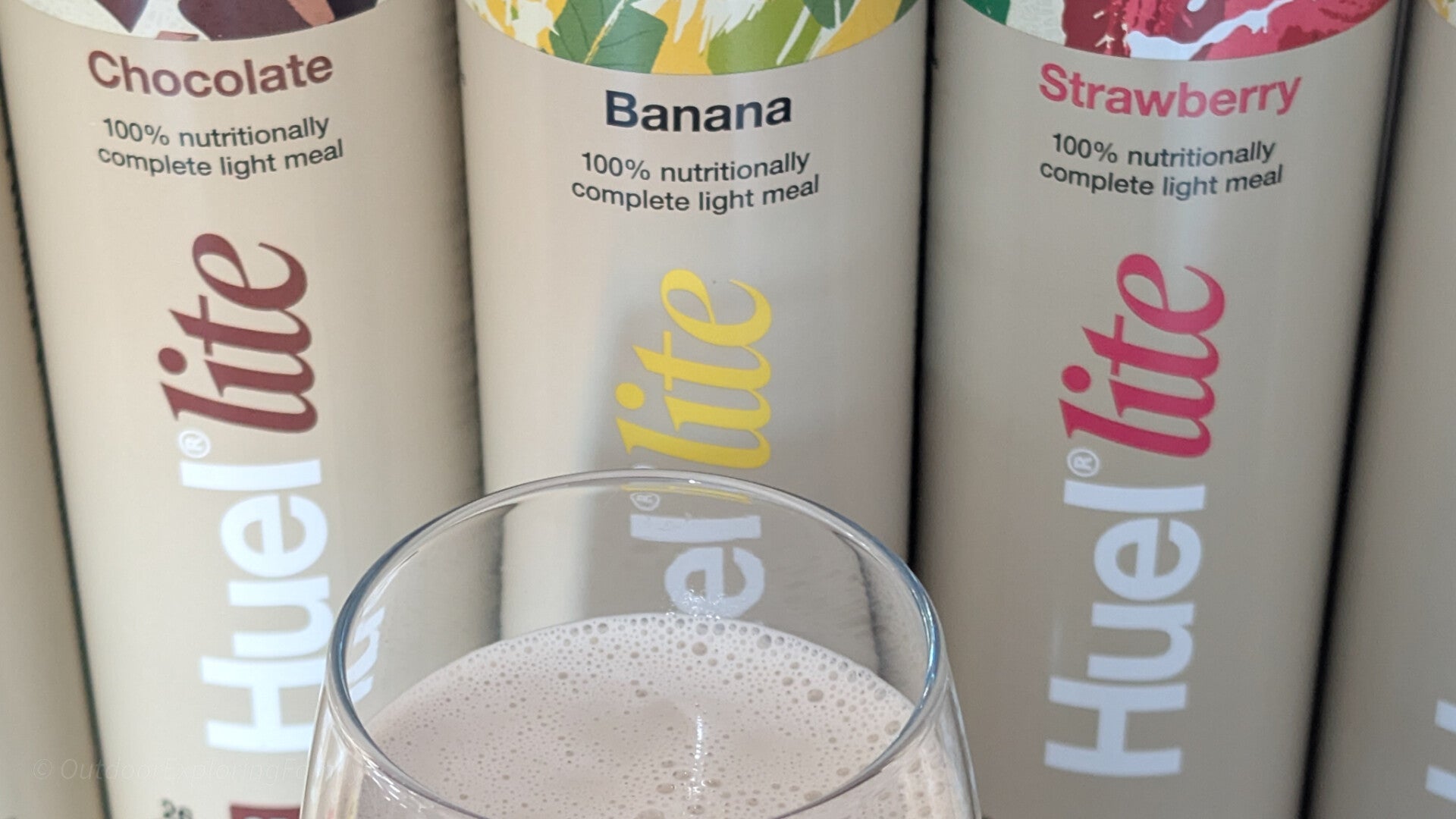 Selection of Huel ready to drink bottles showing different flavours outdoors