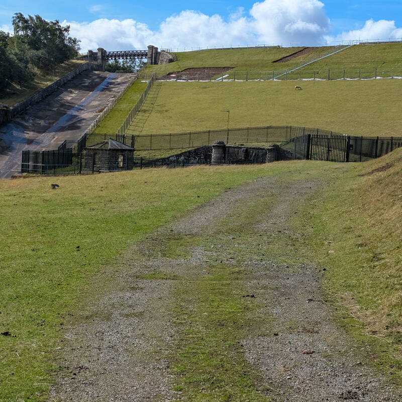 Wider view across the former Hury Mill site beside the River Balder with Hury Reservoir dam behind.