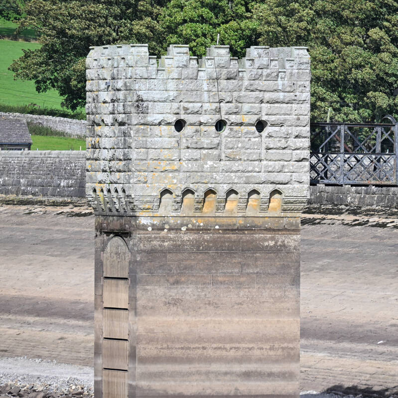 Close view of the stone reservoir tower exposed by the low water at Hury Reservoir during the 2026 drawdown