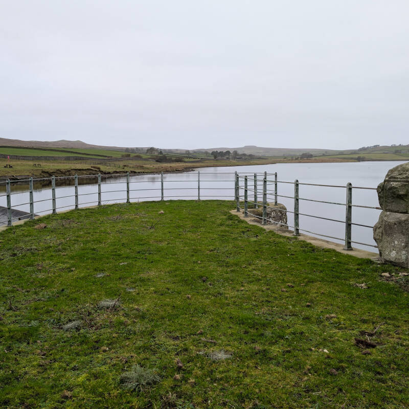View across Hury Reservoir towards the farmland and hills of Baldersdale