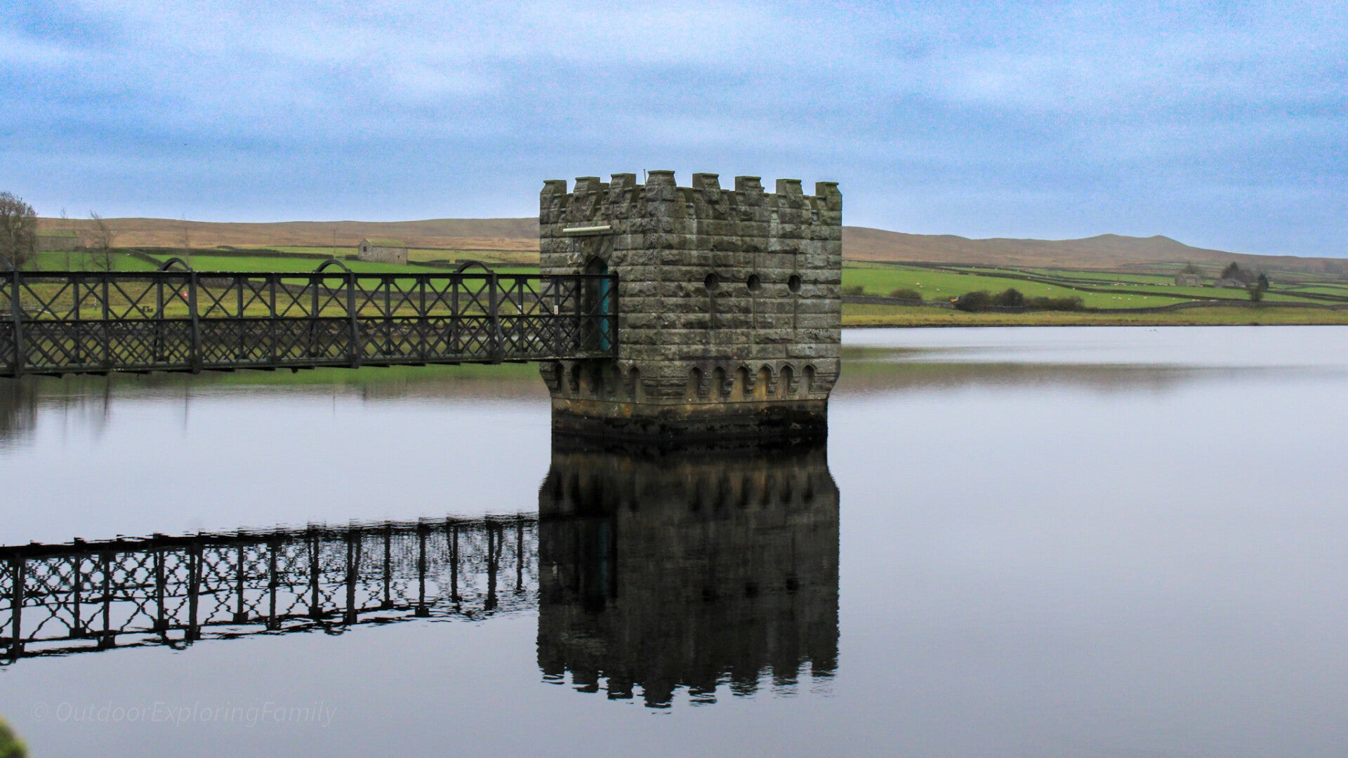 Wide view across Hury Reservoir in Baldersdale with calm water, open fields and rolling Teesdale countryside.