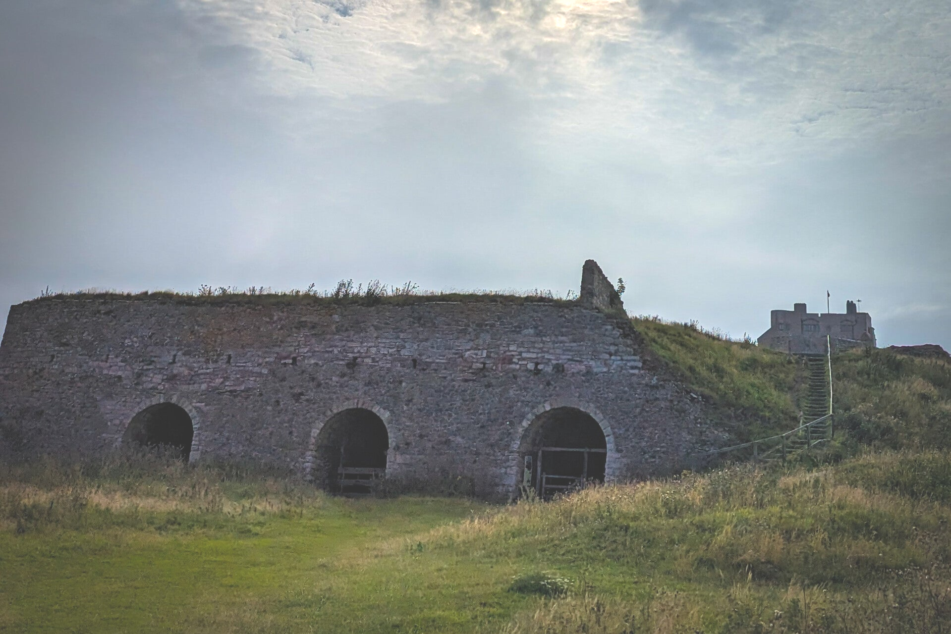 Wide view across Castle Point towards the lime kilns and Lindisfarne Castle on Holy Island