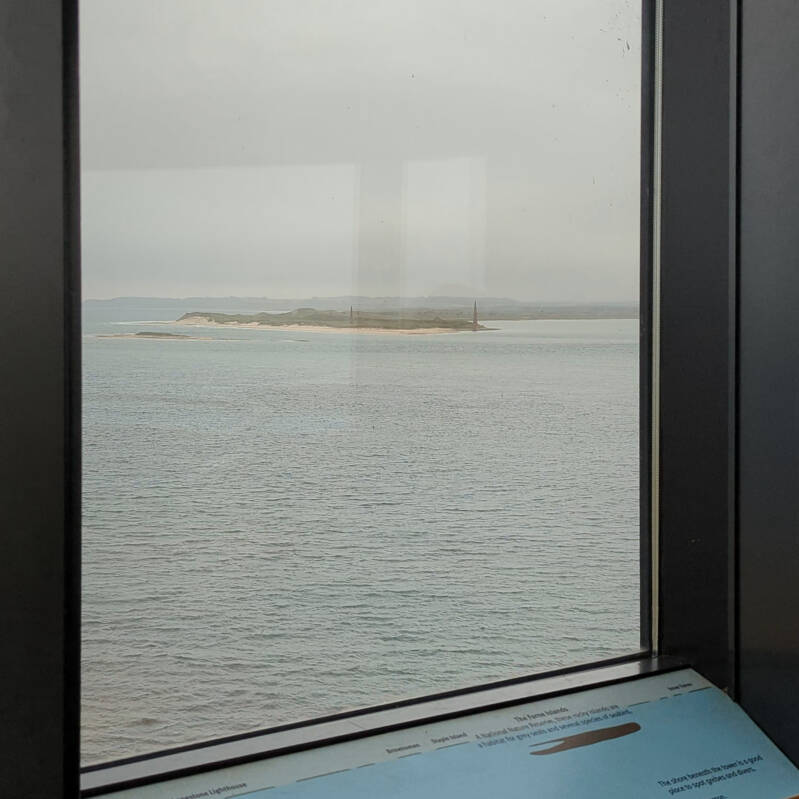 Panoramic coastal view from inside the Holy Island Lookout Tower on Lindisfarne