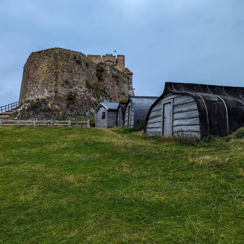 holy-island.jpg Lindisfarne Castle with the traditional upturned boat sheds at Castle Point on Holy Island