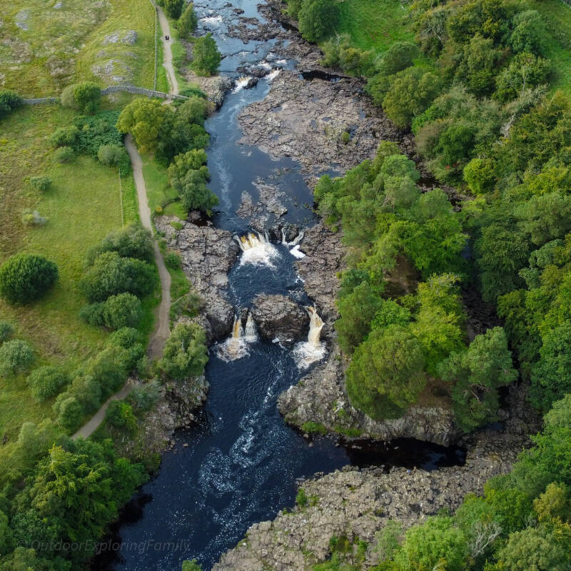Aerial view of Low Force waterfall and the River Tees flowing through rocky gorge near Wynch Bridge in Teesdale
