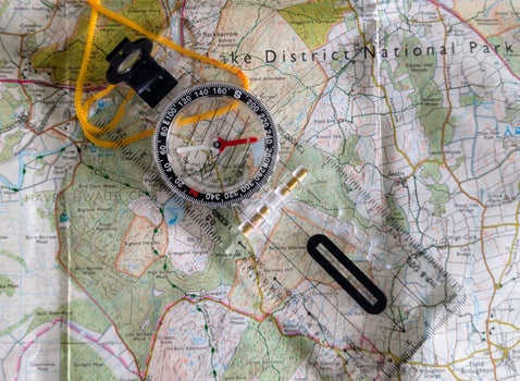 a picture of a os map and compass