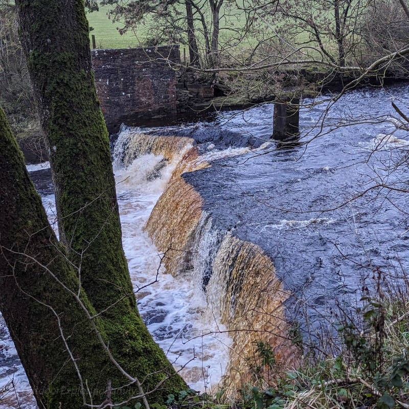 Mill Force waterfall near Bowes, flowing beside the remains of the old mill on the River Greta in Teesdale.