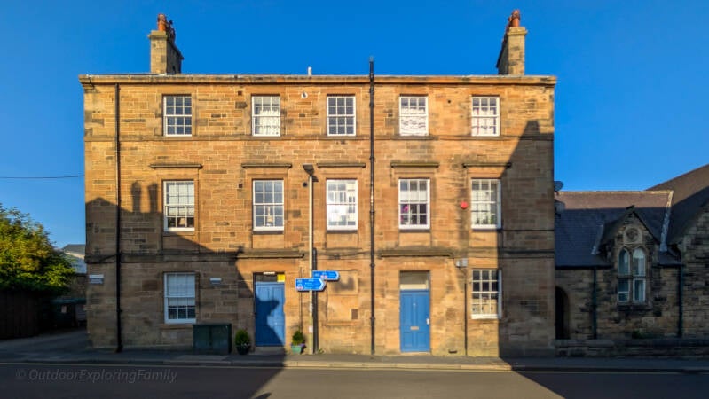 Former Barnard Castle police station and magistrates’ court on Queen Street, seen from Hall Street in warm evening light.
