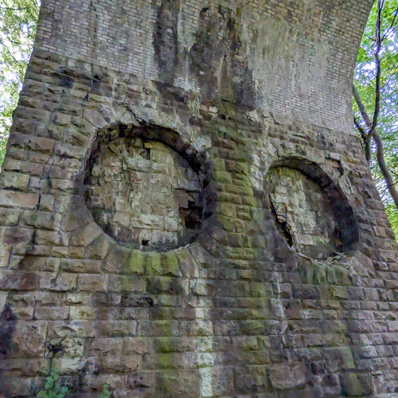 Architectural details on one of the stone piers of Percy Beck Bridge, showing decorative recessed panels beneath the former Stainmore railway near Barnard Castle.