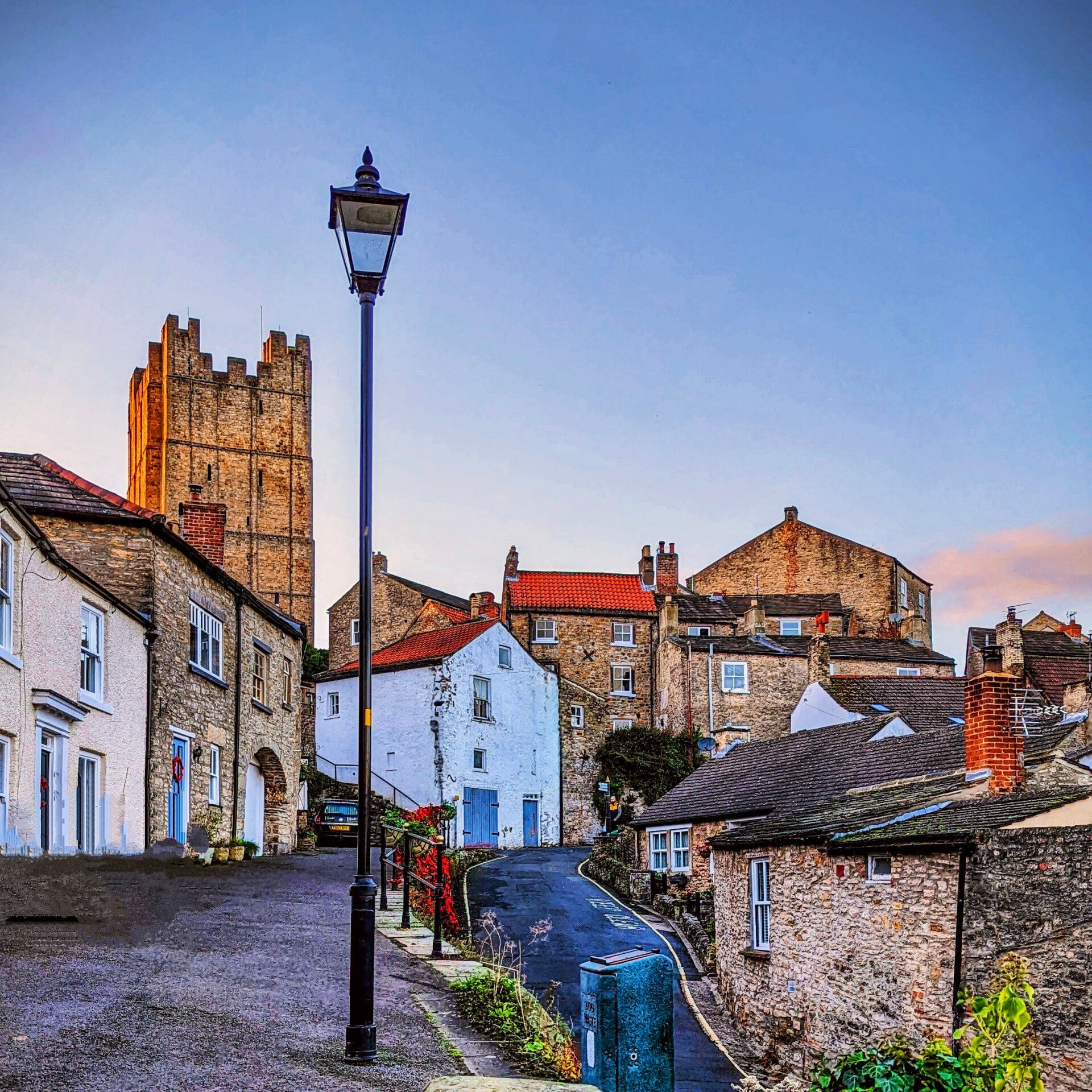 Richmond Castle rising above the River Swale with views across the town