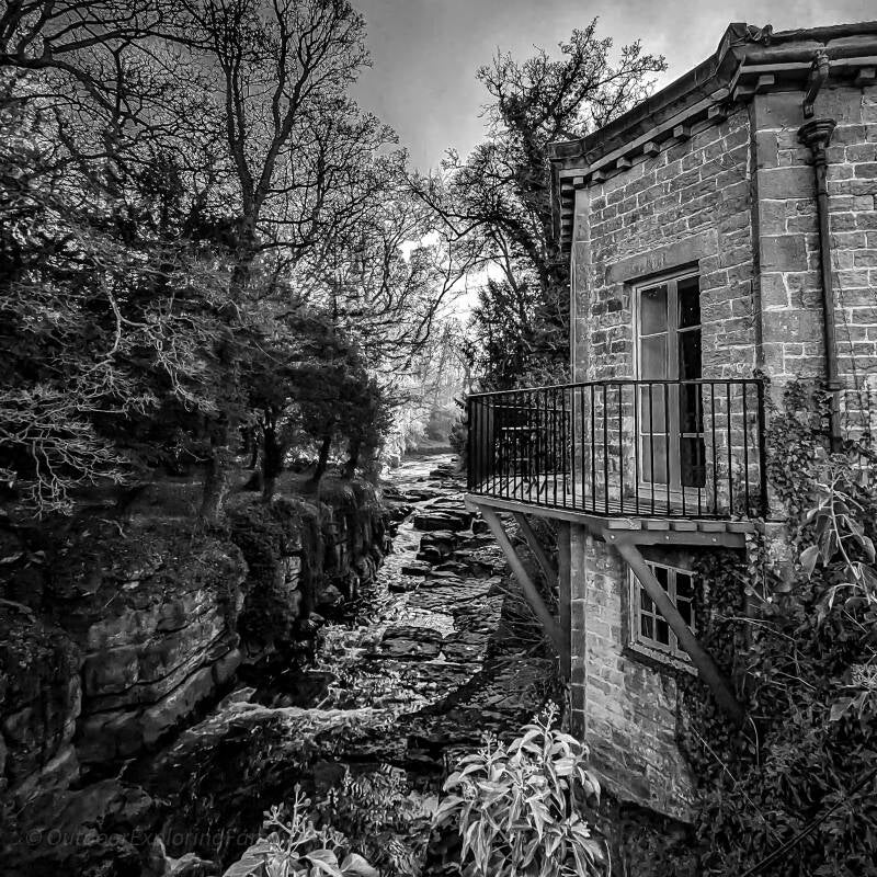 The River Greta flowing beneath Mortham Tower at Rokeby near Barnard Castle, setting of the Mortham Dobby folklore.