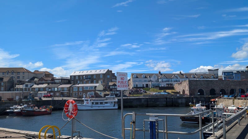 Fishing boats moored inside Seahouses Harbour on the Northumberland coast