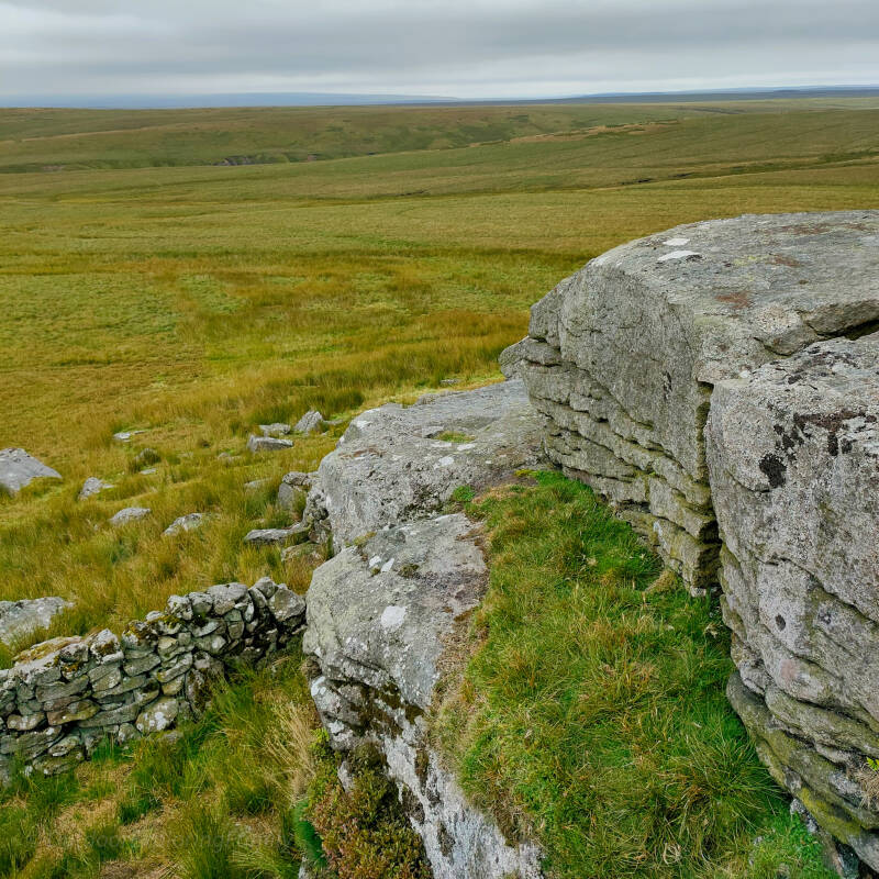 Rocky outcrop on Shacklesborough overlooking Balderhead Reservoir and moorland