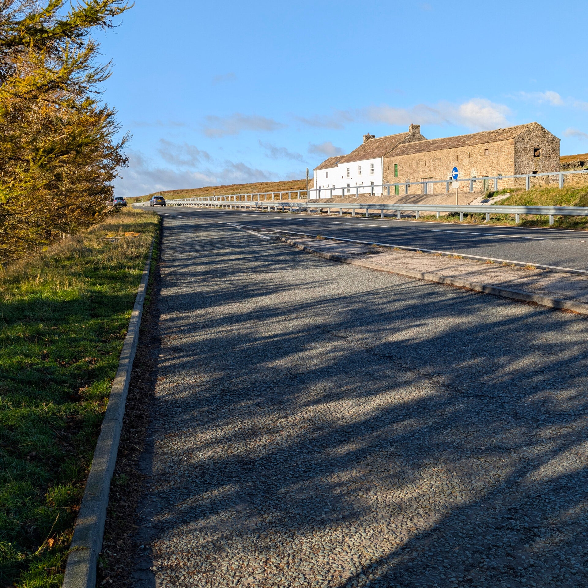 Roadside layby parking area near the start of the Sleightholme Beck Waterfall walk on the A66, Teesdale.