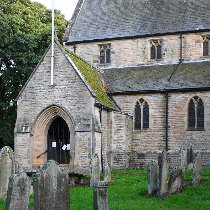Entrance porch and gravestones at St Mary’s Church, Middleton-in-Teesdale