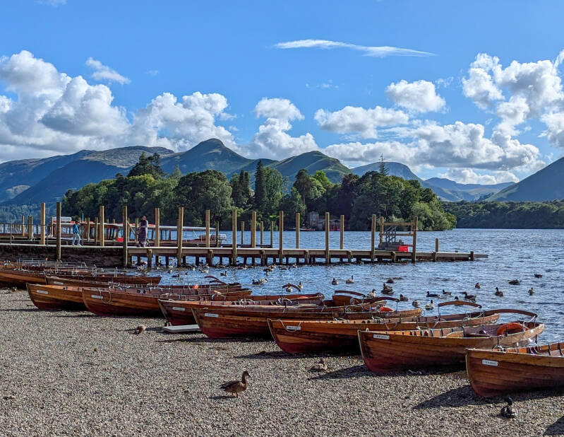Boats on Derwent Water with Catbells rising in the background across the calm lake
