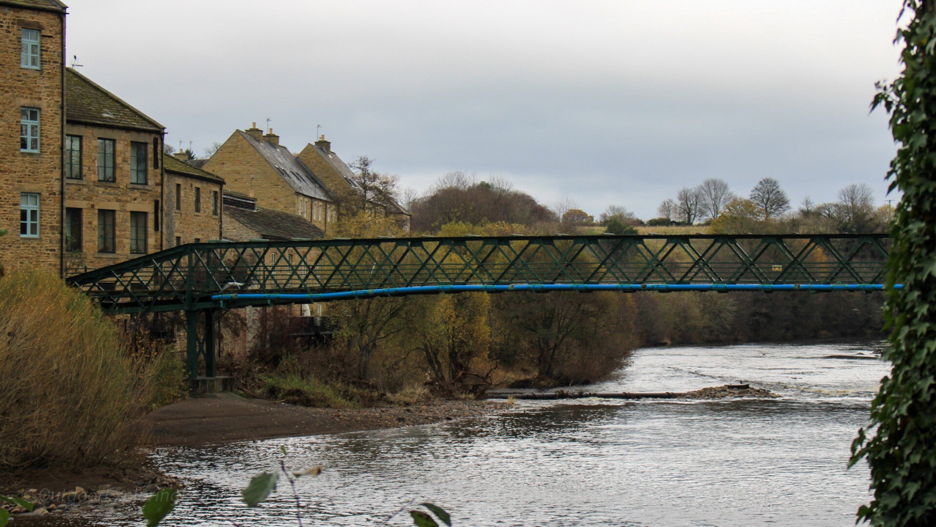 Thorngate Bridge spanning the River Tees from Thorngate in Barnard Castle towards Startforth, with riverside buildings beside the water.