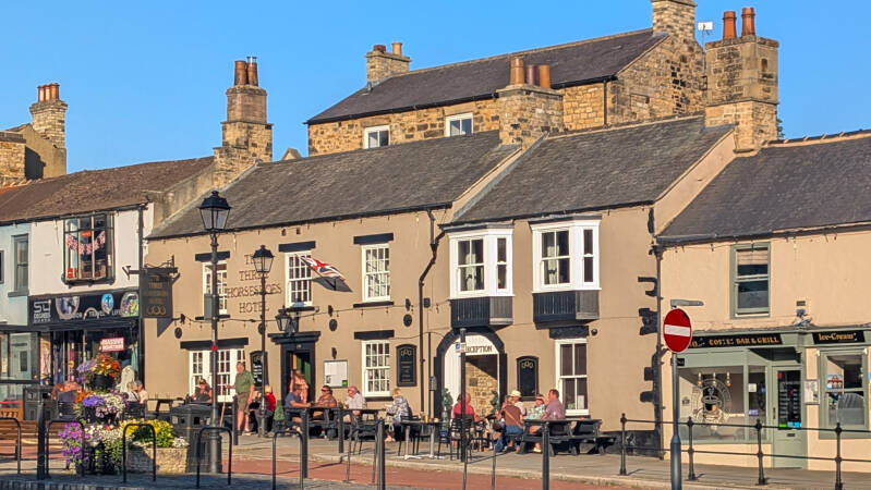 Portrait view of the Three Horseshoes Hotel on Galgate in Barnard Castle, showing the historic frontage and outdoor seating.