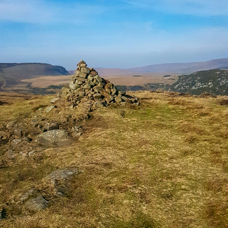 Wide open moorland landscape with rolling hills and distant views on the High Force circular walk