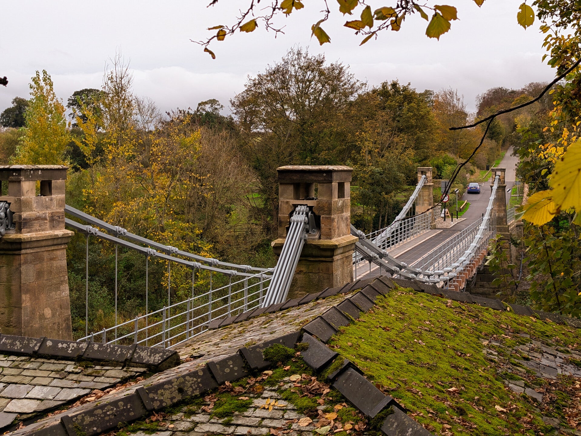 Whorlton Suspension Bridge crossing the River Tees near Barnard Castle, surrounded by autumn woodland following its 2026 restoration.
