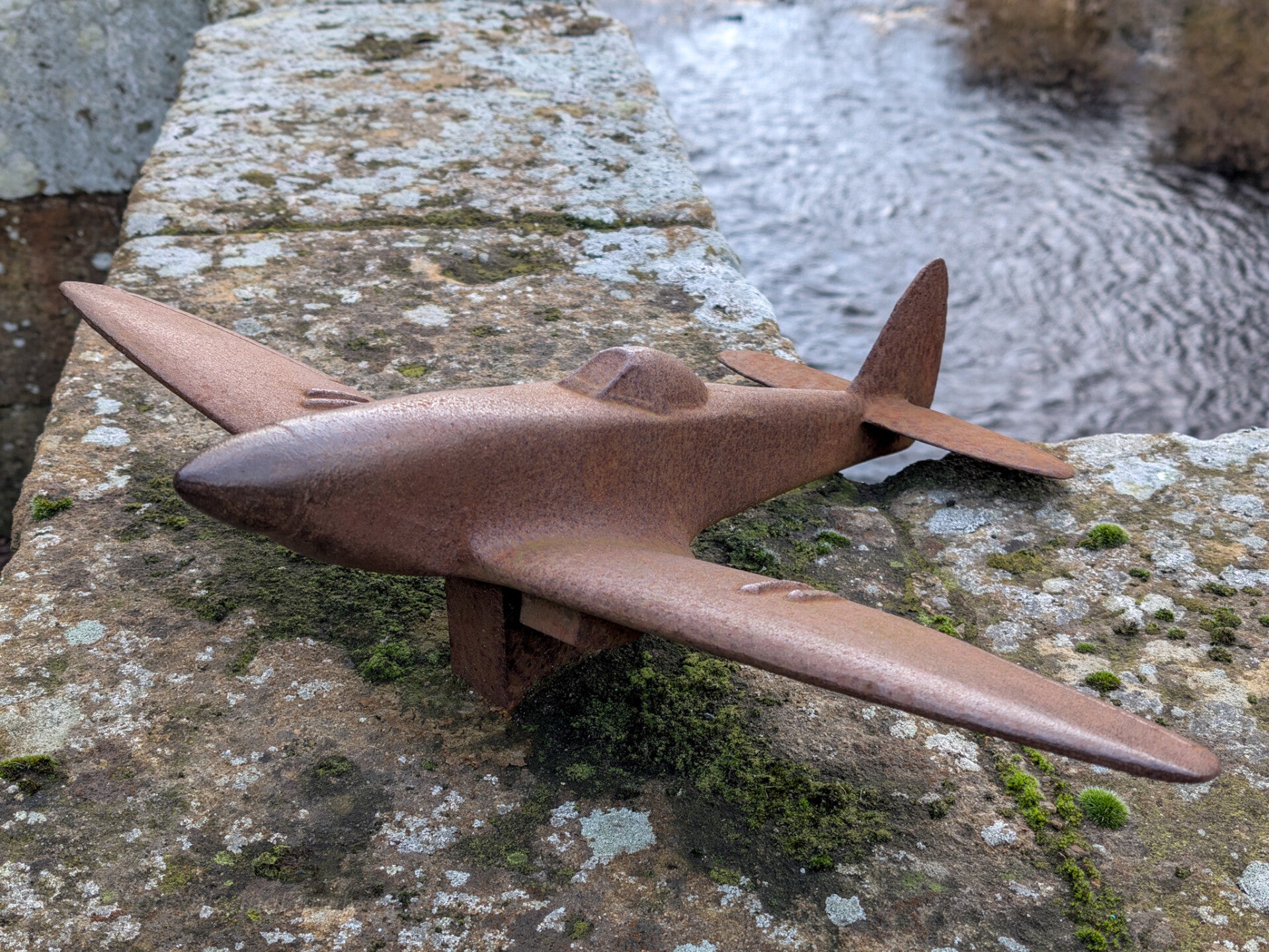 Spitfire model beside the parapet of Winston Bridge overlooking the River Tees in Teesdale, County Durham
