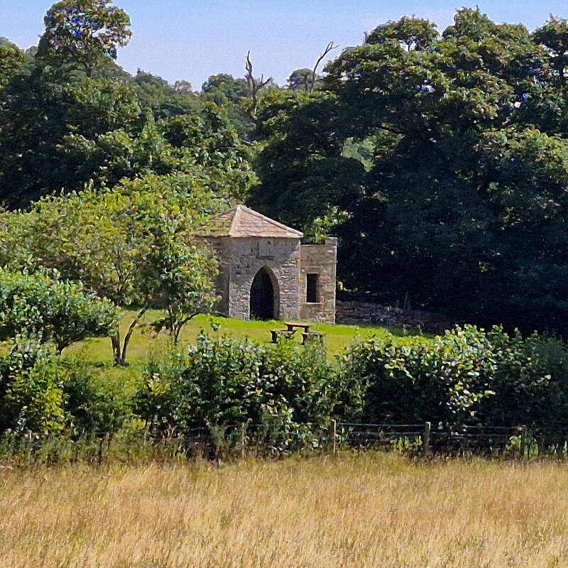 Grade II listed Woden Croft summerhouse with its pointed Gothick doorway near Cotherstone