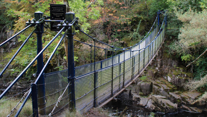 Wynch Bridge suspension footbridge with iron supports and timber walkway above the River Tees at Low Force Teesdale