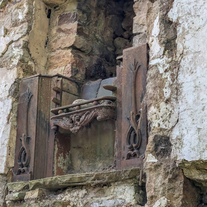 Decorative cast-iron fireplace surviving on the upper floor of the smaller house at Yew Tree Farm