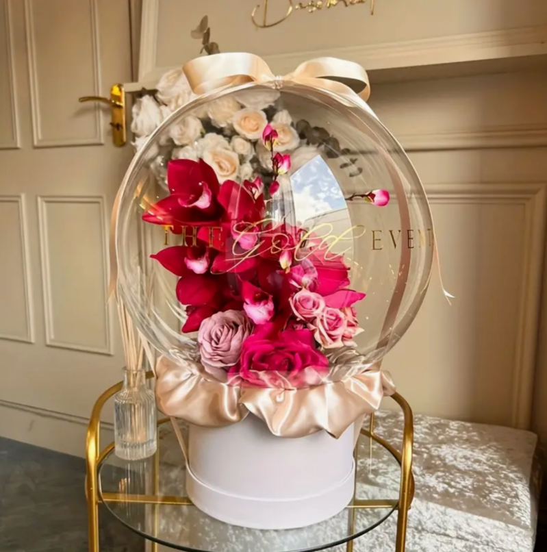 Transparent balloon filled with florals great for any occasion anniversaries, valentines, birthdays.png