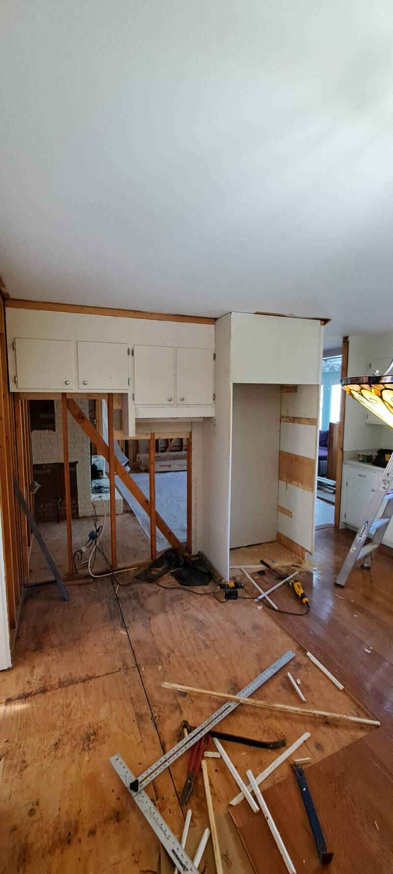 Kitchen remodel before image showing exposed framing, removed cabinetry, and subfloor preparation as New Looks 4 Home LLC begins structural updates during a renovation in Upstate South Carolina.