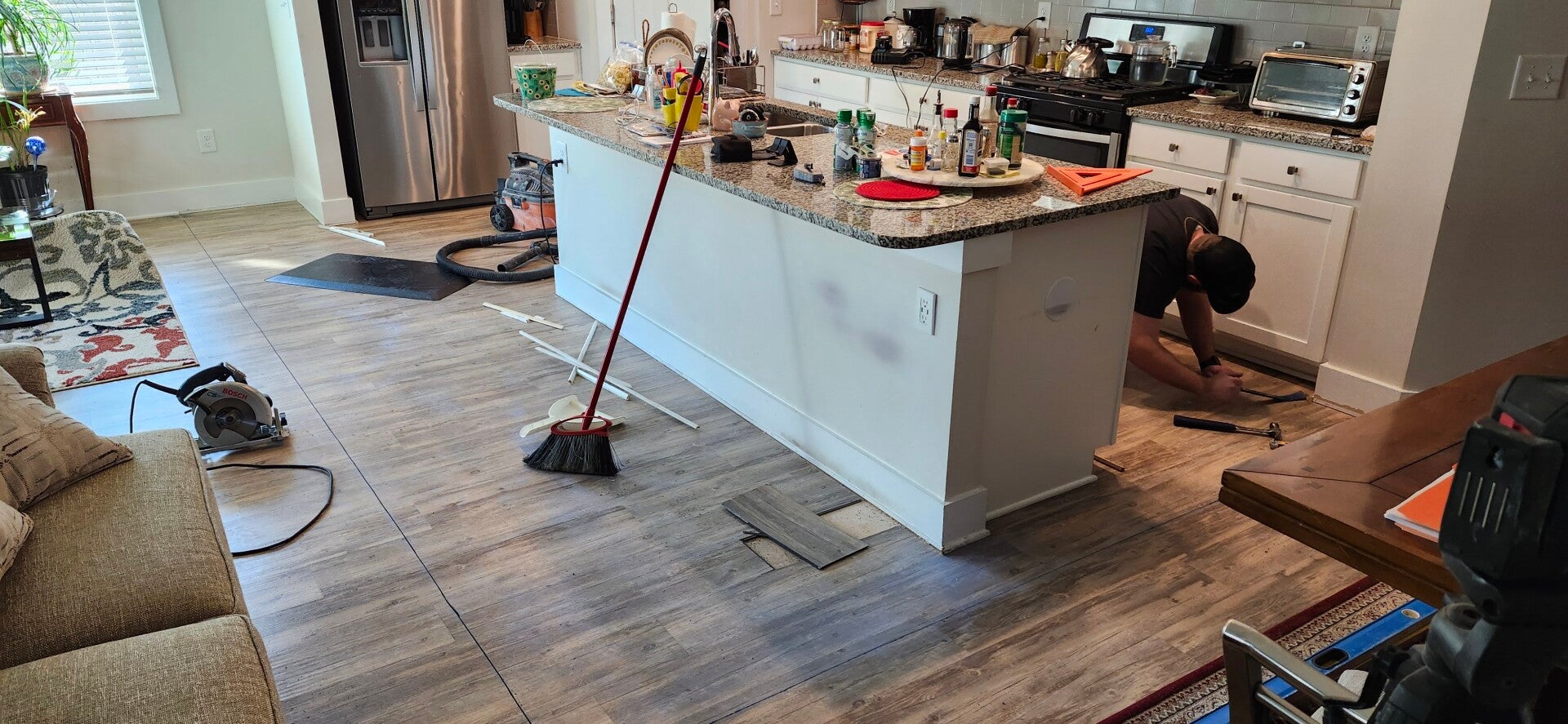 "Kitchen remodel before image showing outdated flooring being removed and prep work underway as New Looks 4 Home LLC begins a full kitchen renovation in Upstate South Carolina