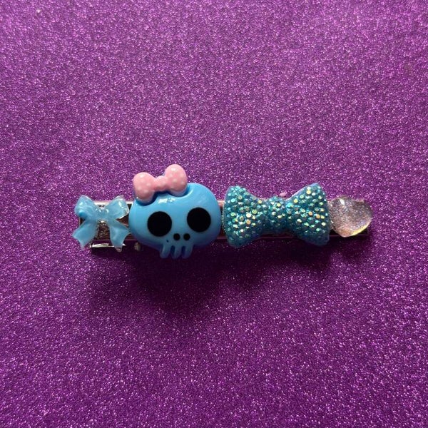 Blue skull and bows silver hair clip