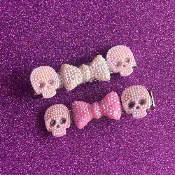 Pink rhinestone skull and bow silver hairclip set