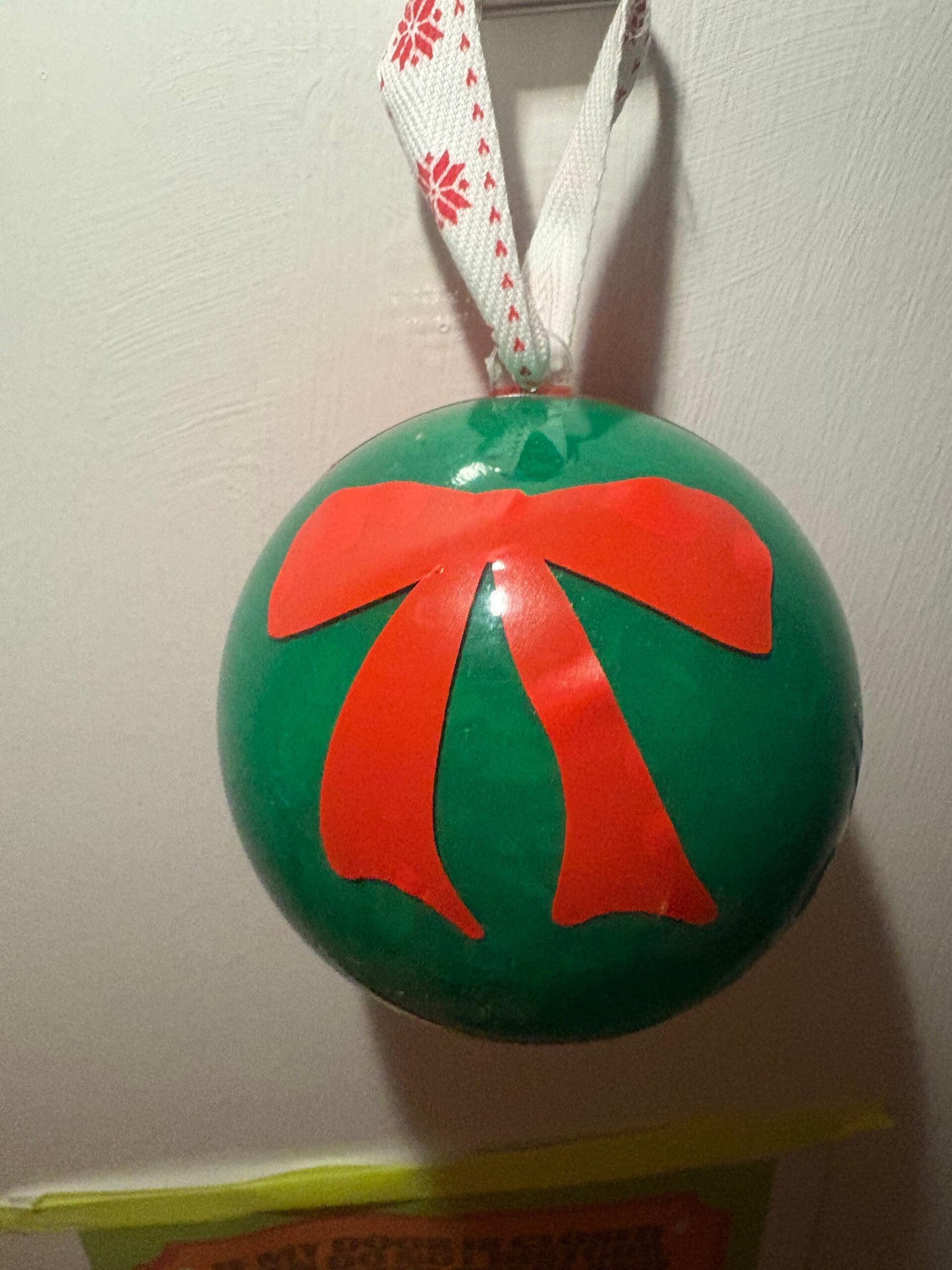 Tied with love with bow design bauble.