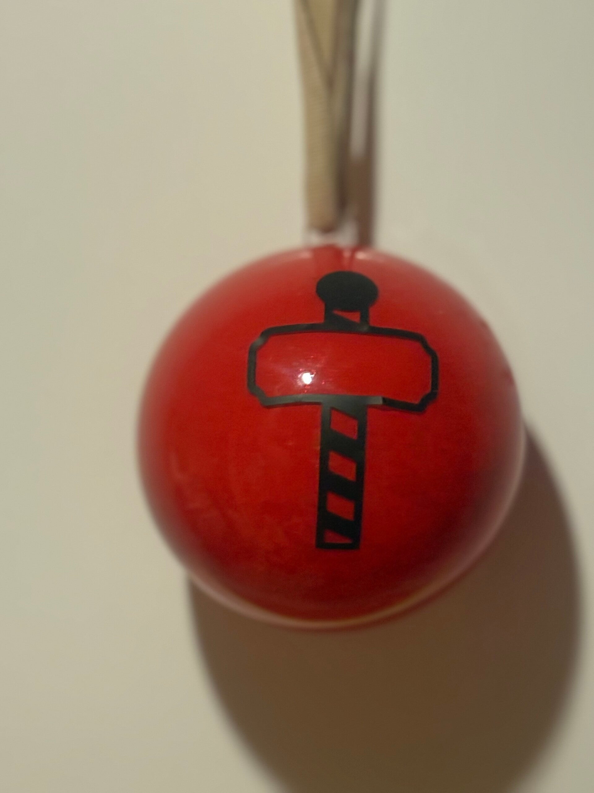 red bauble with north pole
