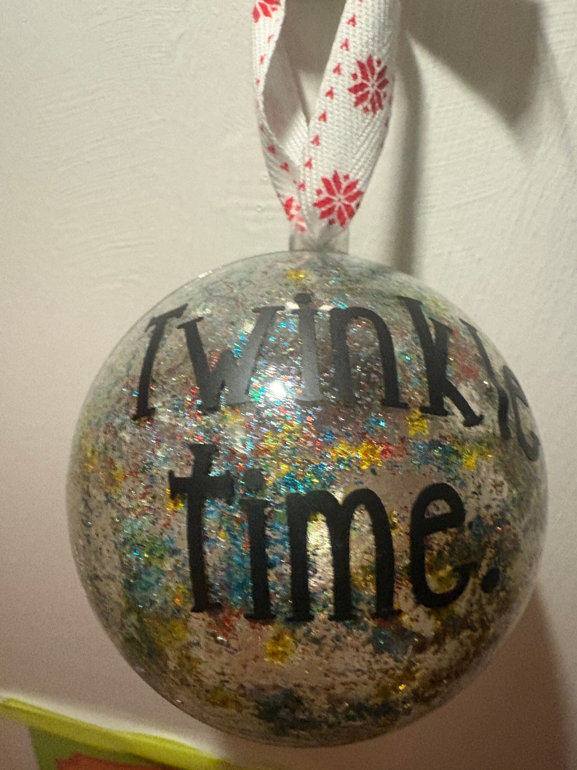 Silver glitter bauble with twinkle time wording