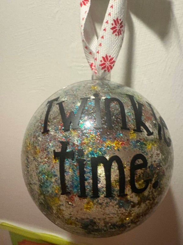 Silver glitter bauble with twinkle time wording