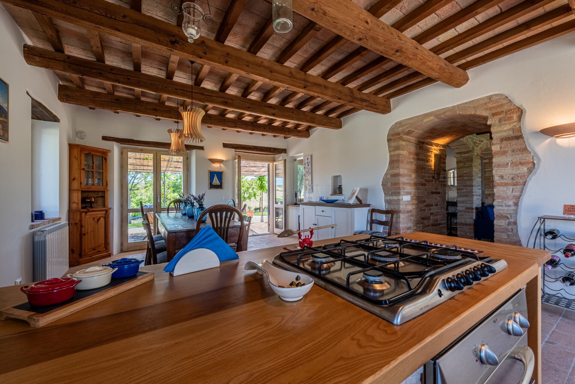 Enjoy a fully equipped kitchen and spacious dining area that opens right up to the beautiful outdoors