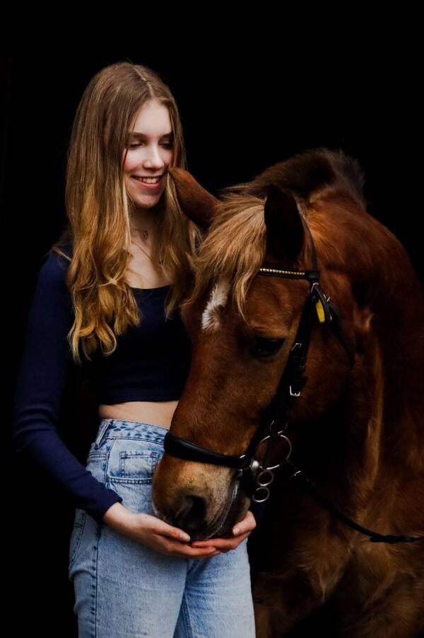 An equestrian and her equine partner